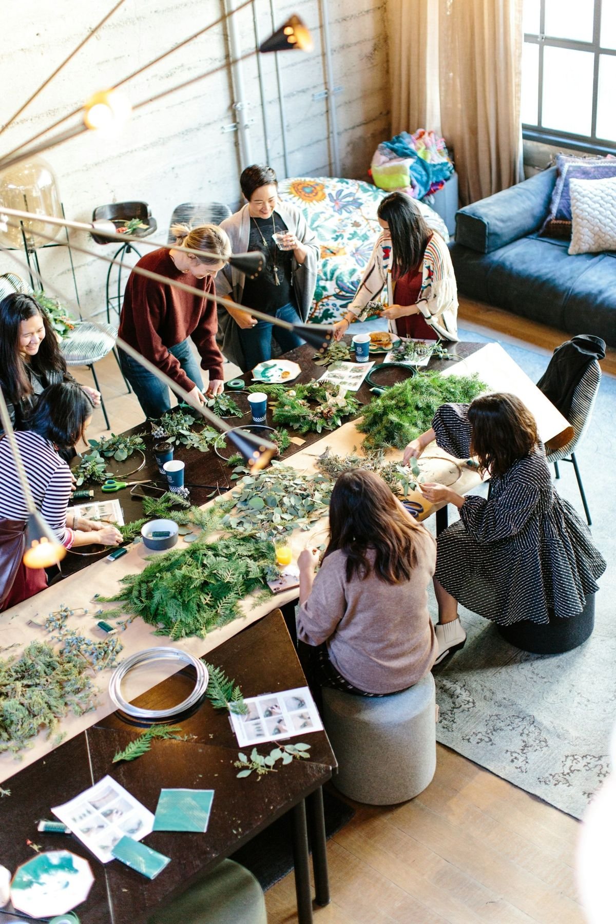 People working together at a community workshop table